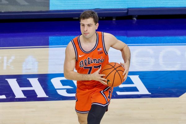 Sophomore guard Mihailo Petrović catches a pass in Illinois’ win over Penn State on Jan. 3.