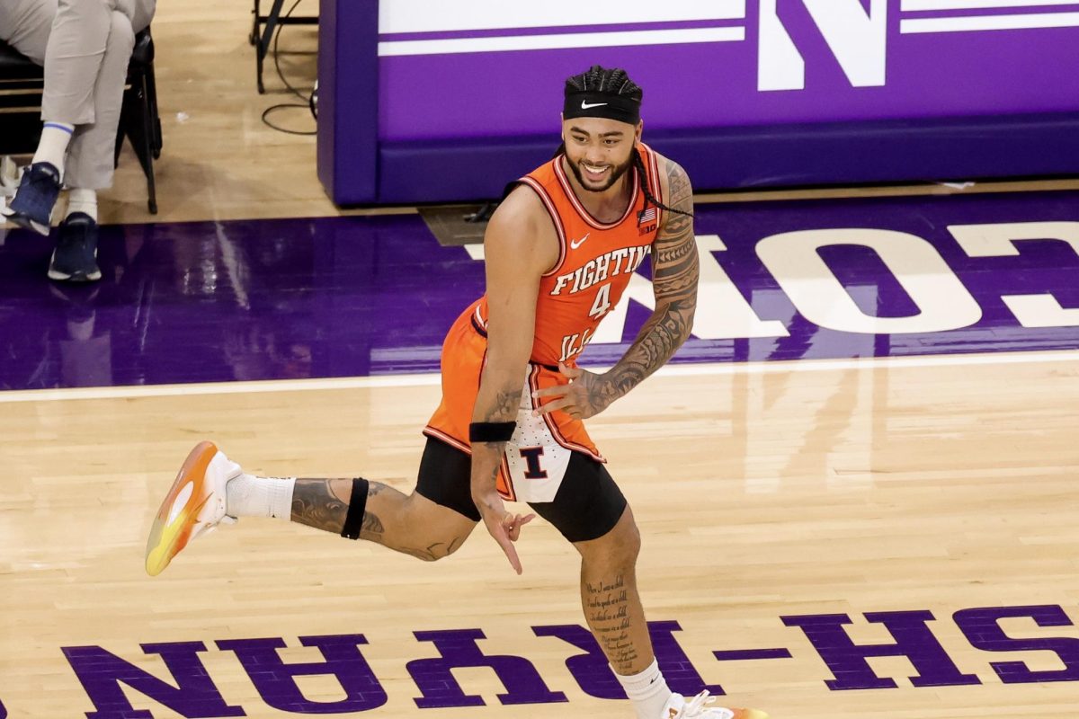 Senior guard Kylan Boswell celebrates while running back on defense after freshman guard Keaton Wagler drained a 3-pointer at Northwestern on Jan. 14.