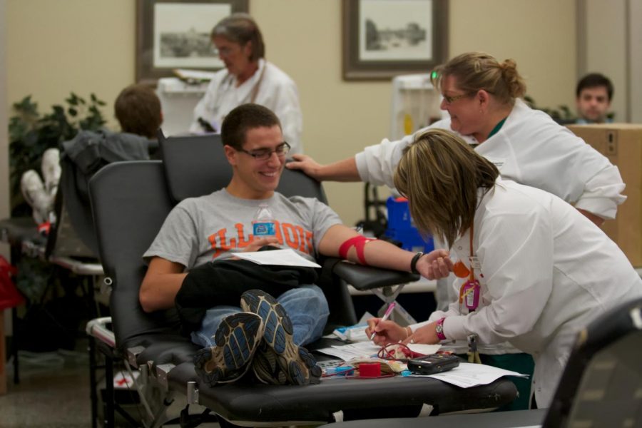 A student donates blood at a drive. The American Red Cross is seeking donations to combat a winter shortage.