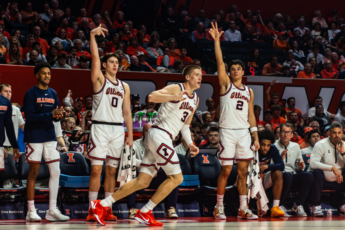 Freshman forward David Mirković and junior wing Andrej Stojaković celebrate a made three-pointer by graduate student forward Ben Humrichous in Illinois' win over Rutgers on Jan. 9. 