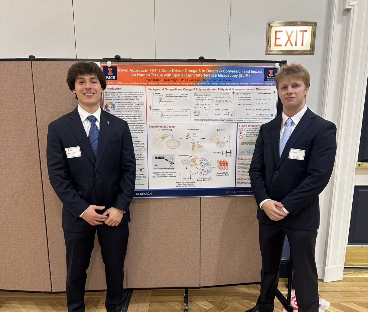 Sam Najjar and Ryan Marsh, seniors in LAS, stand in front of a research poster describing their work. The pair hopes to combat inflammation which contributes to cardiovascular disease.