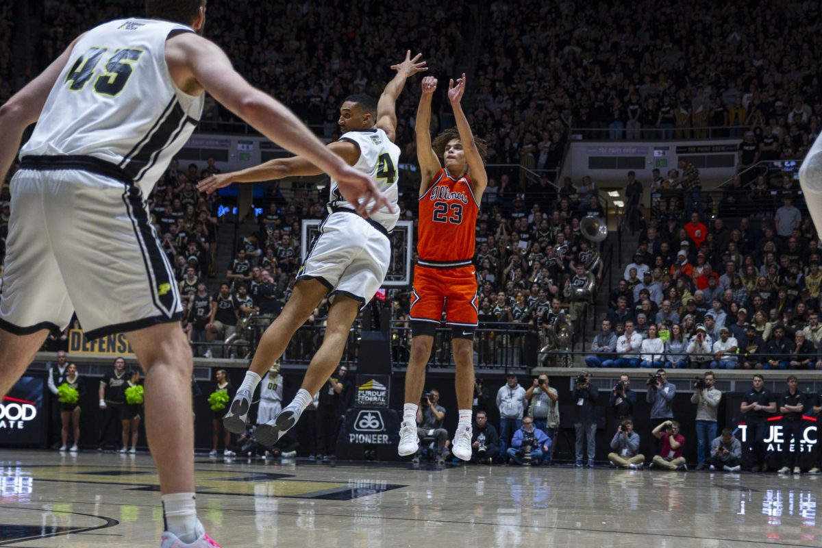 Freshman guard Keaton Wagler hits a three over Purdue's Trey Kaufman-Renn in Illinois' win over Purdue on Jan. 24, 2026. Wagler ended the game with 46 points.