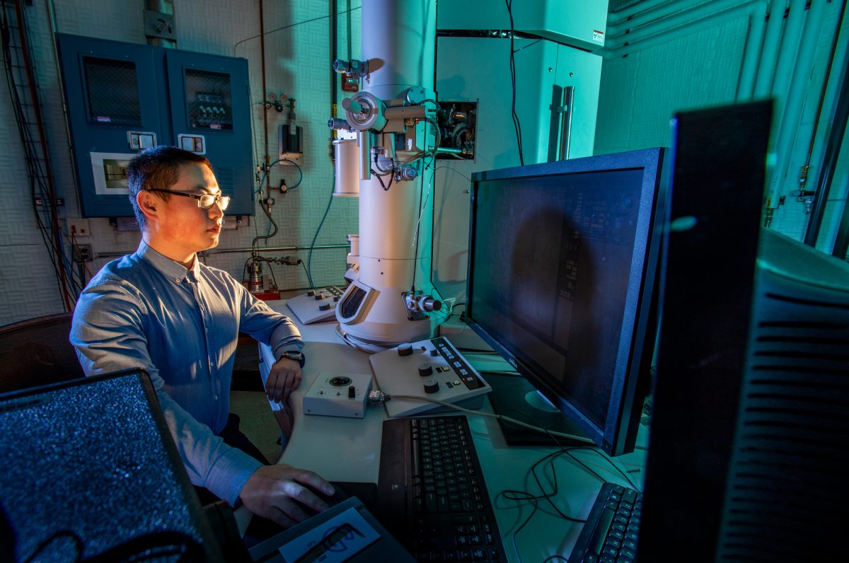 Research grad student Zihao Ou uses a transmission electron microscope to study nanoparticle crystallization pathways, which led to the finding of a three dimensional honeycomb lattice structure in the materials. Their work was done at the Illinois Materials Research Laboratory.