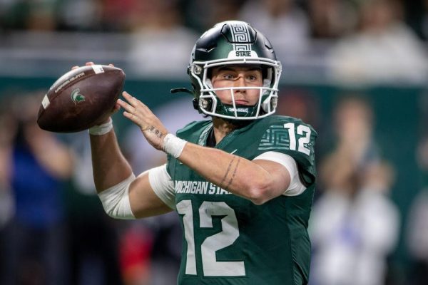 Michigan State quarterback Katin Houser prepares to throw.