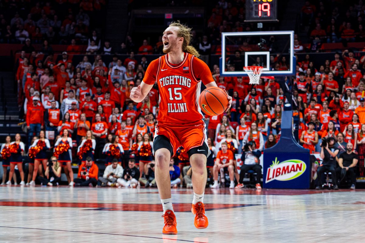 Junior forward Jake Davis dribbles the ball towards the three point line during Illinois' game on Jan. 29 against Washington.