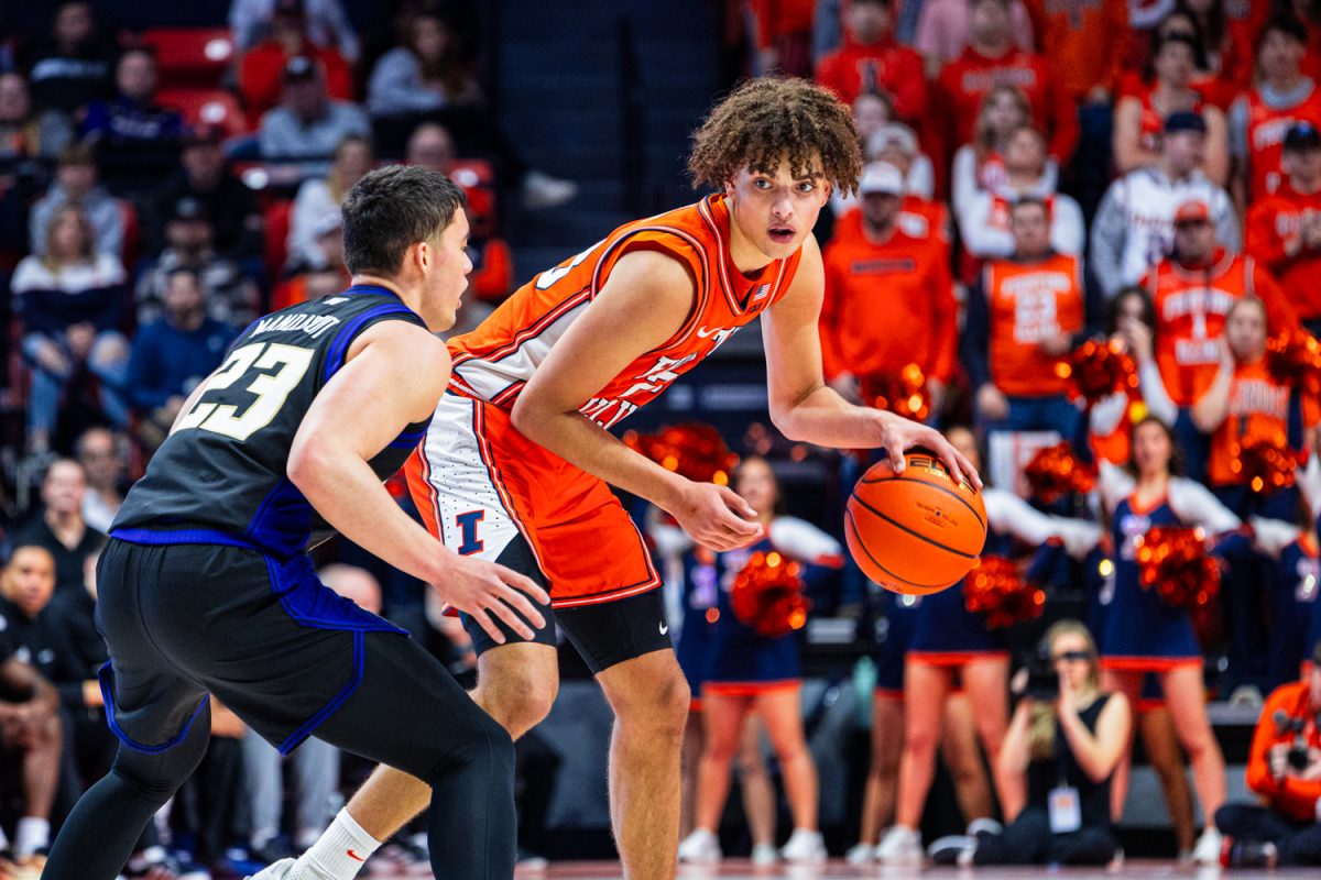Freshman guard Keaton Wagler dribbles the ball while defended in Illinois' win over Washington on Jan. 29, 2026.