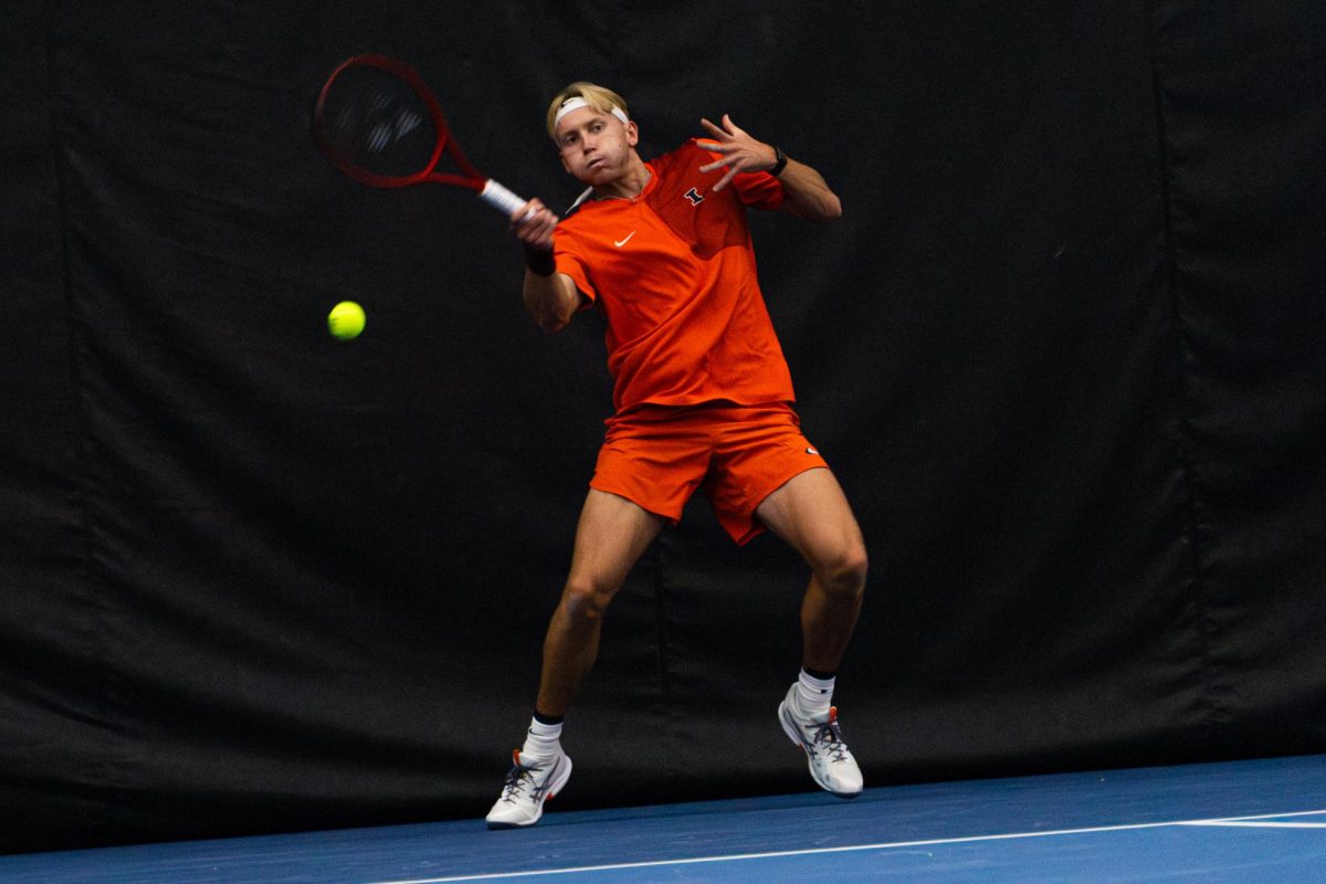 Senior William Mroz hits a forehand during his singles match as Illinois played No. 15 Duke on Jan. 30 at Atkins Tennis Center in Urbana. Illinois defeated Duke 4-1.