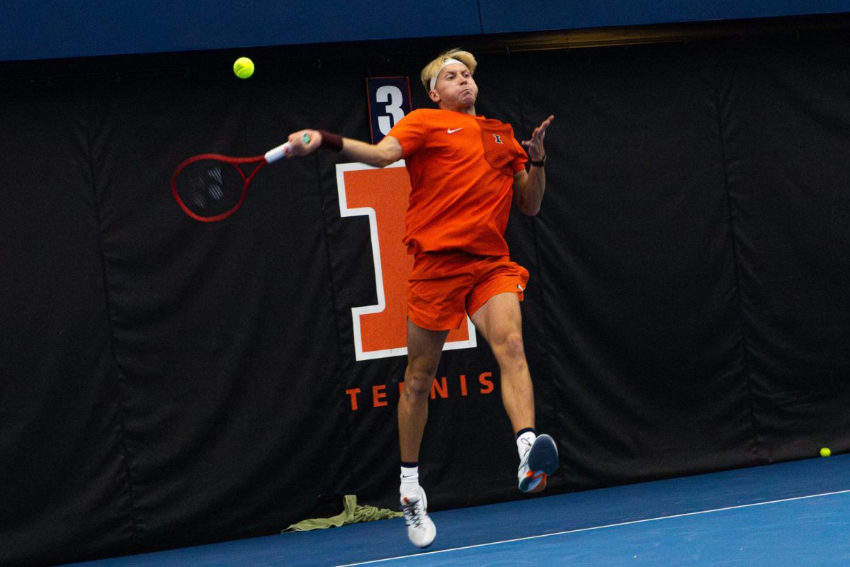 Senior William Mroz hits a forehand in his singles match against No. 15 Duke on Jan. 30 at Atkins Tennis Center in Urbana. Mroz won his singles match and Illinois won 4-1 overall.