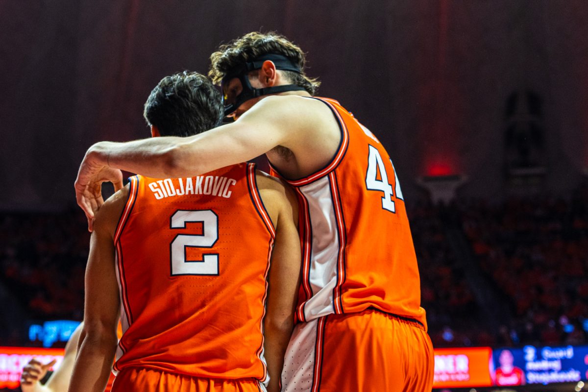 Junior center Zvonimir Ivišić hugs junior wing Andrej Stojaković after he scores during the Illinois vs. Northwestern game Feb. 4. Illinois defeated Northwestern 84-44, cementing its twelfth win in a row.