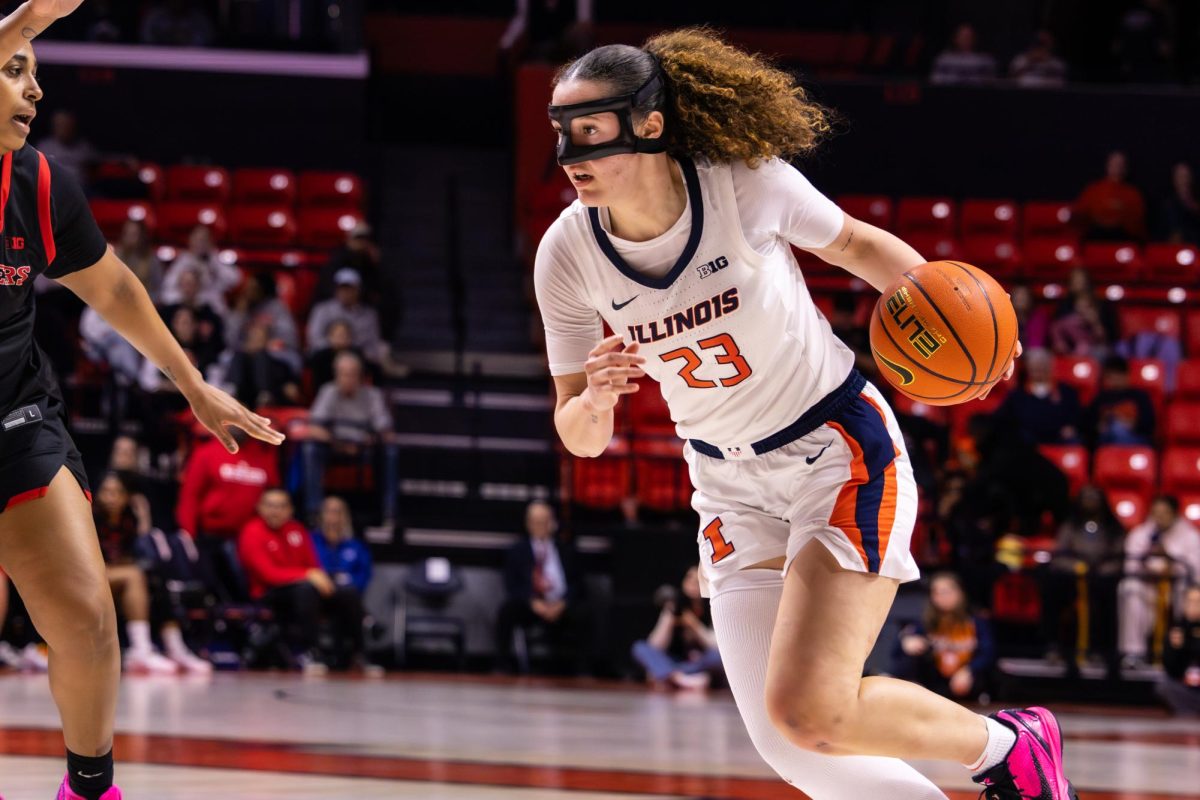Sophomore forward Berry Wallace dribbles the ball down court during the Illinois women’s basketball team’s game against Rutgers on Feb. 17 at the State Farm Center. The Illini beat the Scarlett Knights 76-56.
