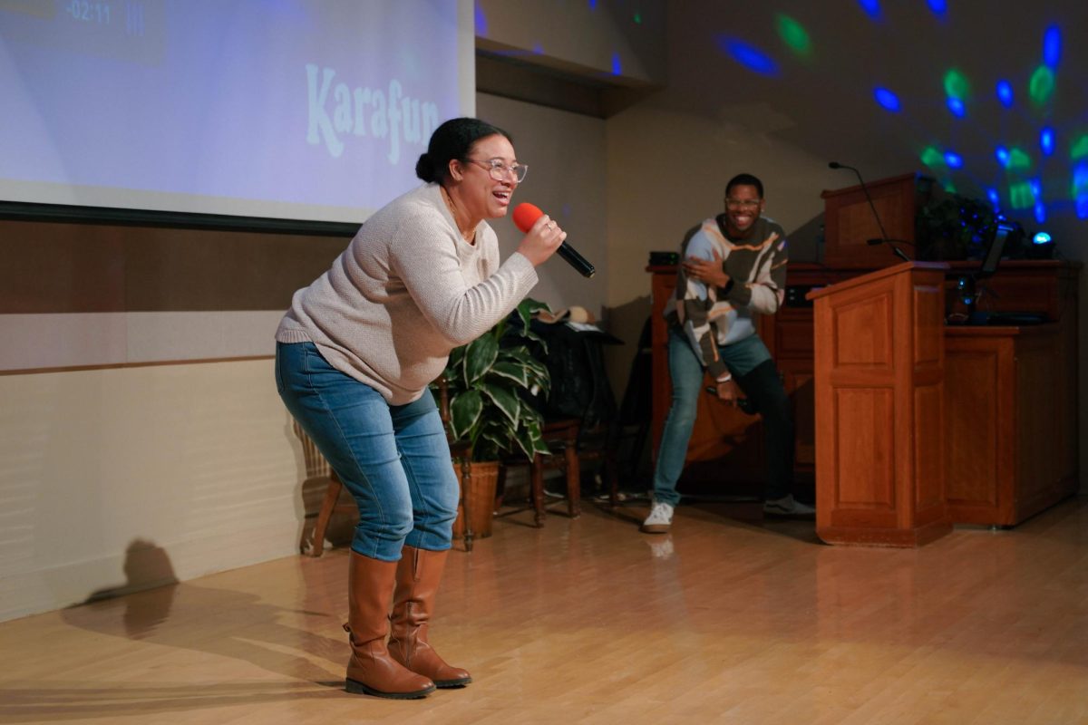 Alexandria Campion sings on stage during the And Ya’ Don’t Stop! Hip Hop Karaoke event at Spurlock Museum on Wednesday. Participants queued songs to perform hip hop classics karaoke-style throughout the evening.