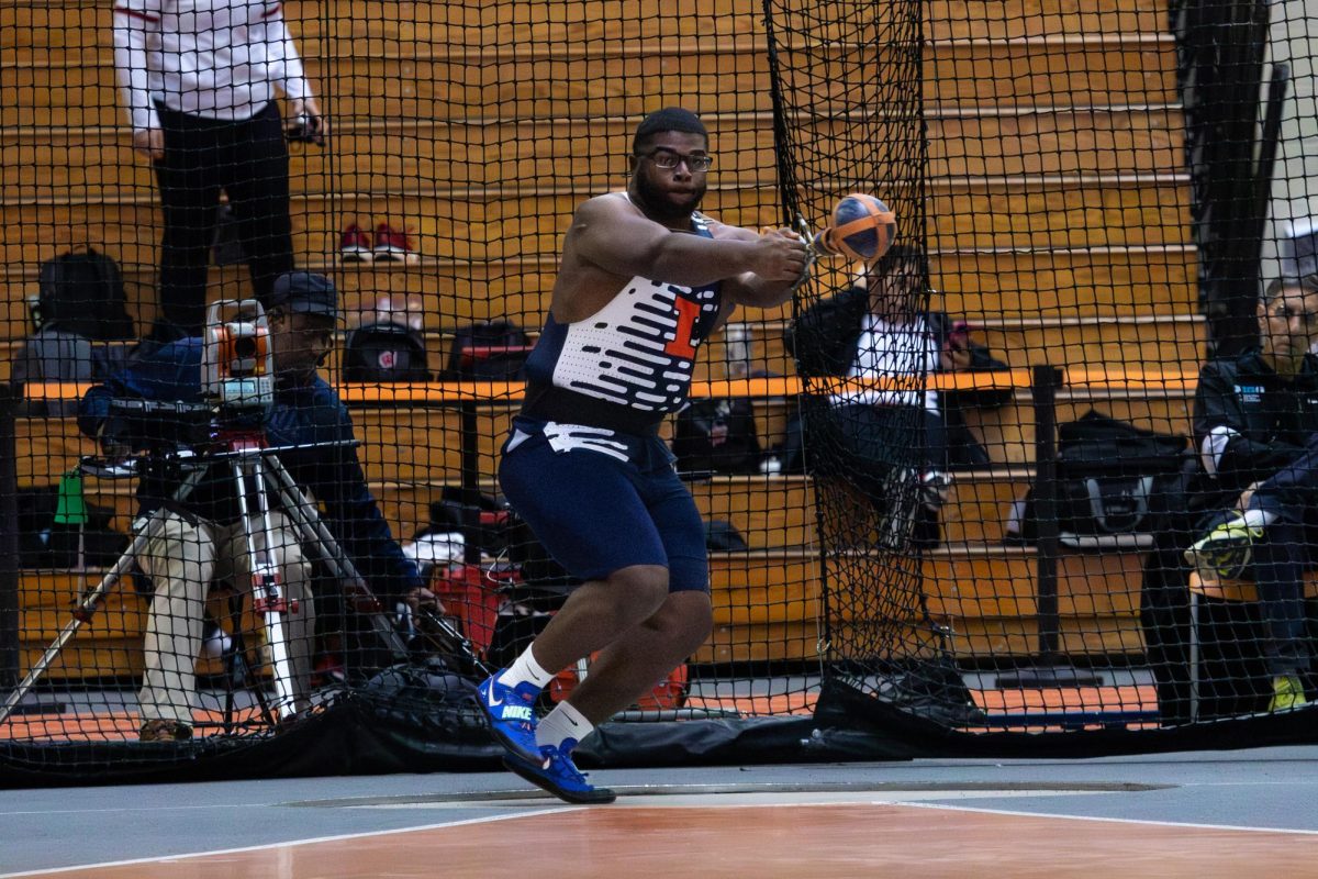 Junior thrower Javaris Ambrose participates in the weight throw on the third day of the Fighting Illini Challenge and Combined Events at the Armory on Jan. 24. 