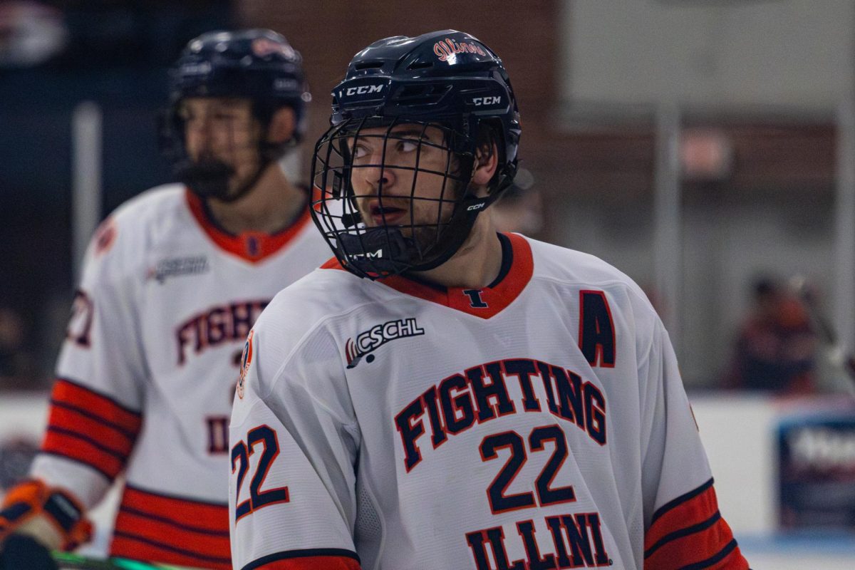 Sophomore forward Carson Mitchell looks over to the opposing side after an attempted goal against Rutgers during their Nov. 1, 2025, matchup at the University of Illinois Ice Arena.