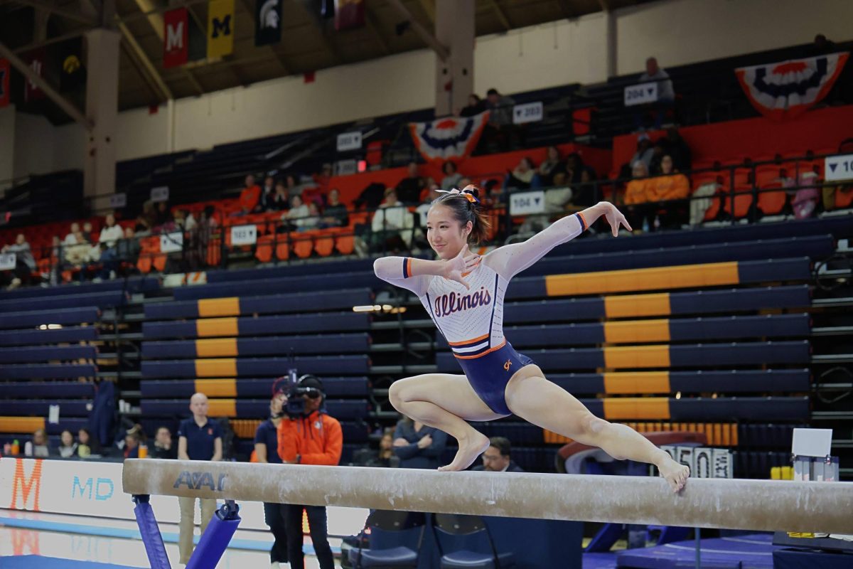 Sophomore Chloe Cho performs a wolf turn on her beam routine at the gymnastics meet against the Maryland on Feb. 1. The meet was held at Huff Hall and Cho scored a 9.85 on this routine.