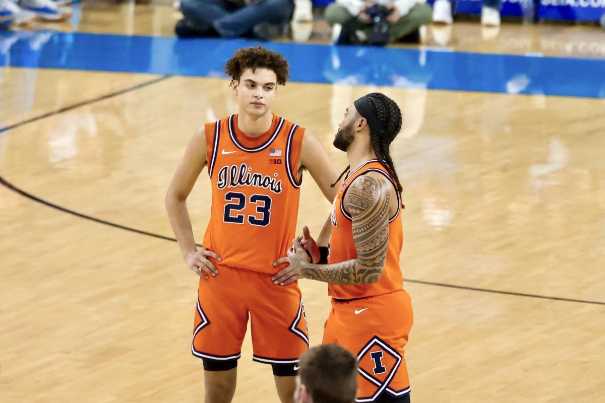 Freshman guard Keaton Wagler talks to senior guard Kylan Boswell while Illinois shoots a free throw during its overtime loss to UCLA at Pauley Pavilion on Feb. 21. 