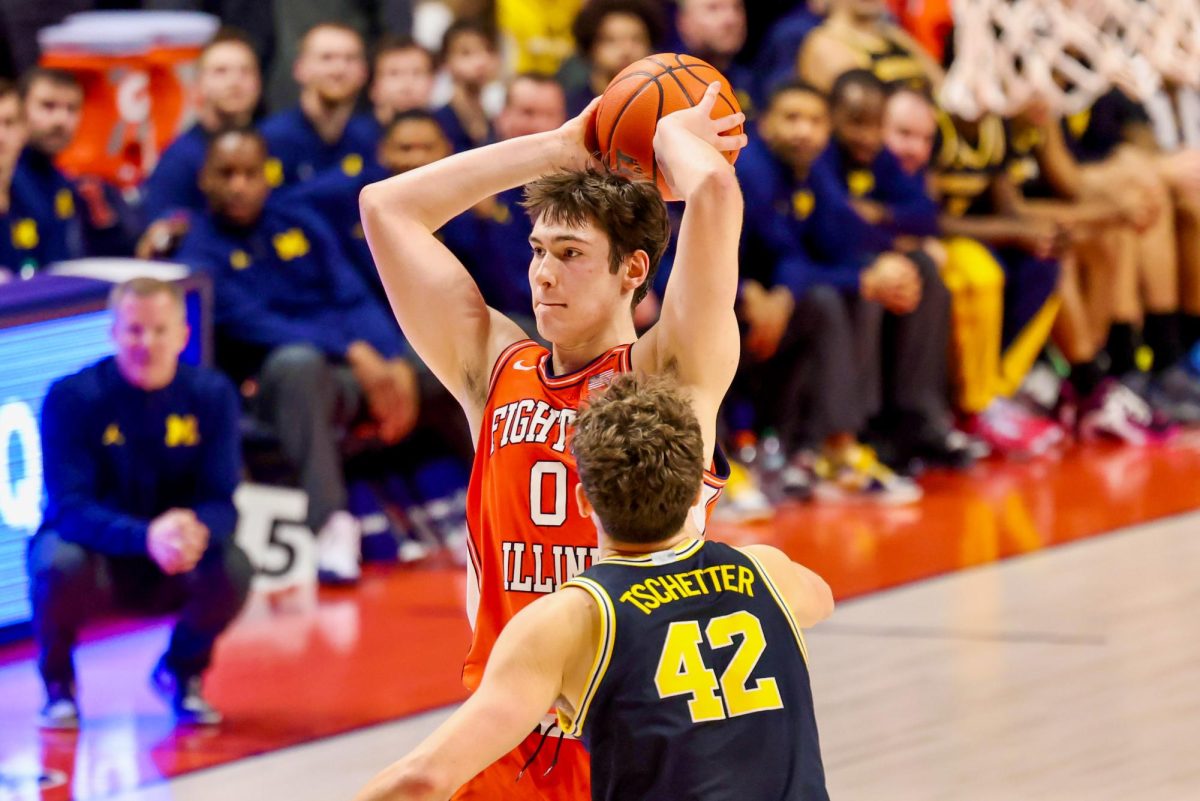 Freshman forward David Mirković looks to make a pass in the second half of No. 10 Illinois’ 84-70 loss to Michigan on Feb. 27 at State Farm Center.