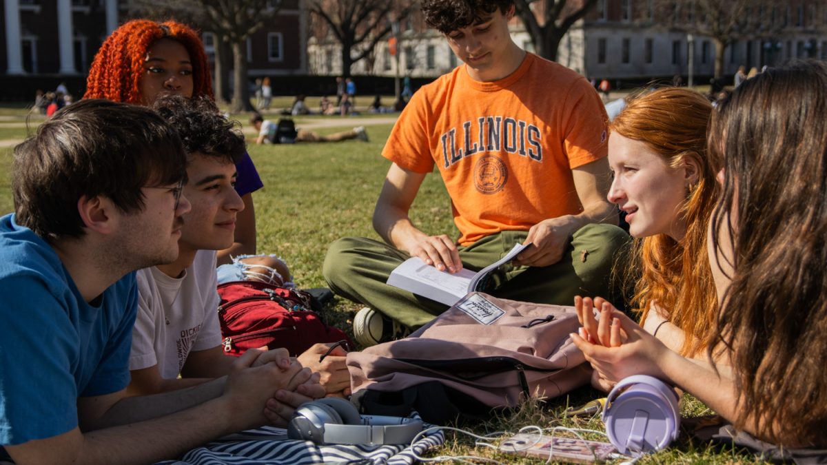 Friends lay out on the Main Quad, chatting and enjoying sunny weather on March 12, 2025.