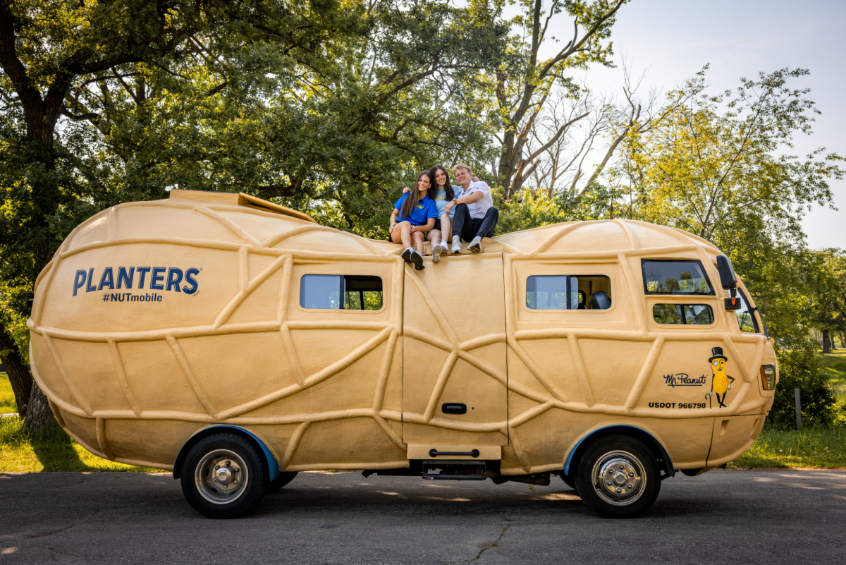 Adleigh Mayes, Aria Conte and Hudson Ritchie pose atop the Nutmobile.