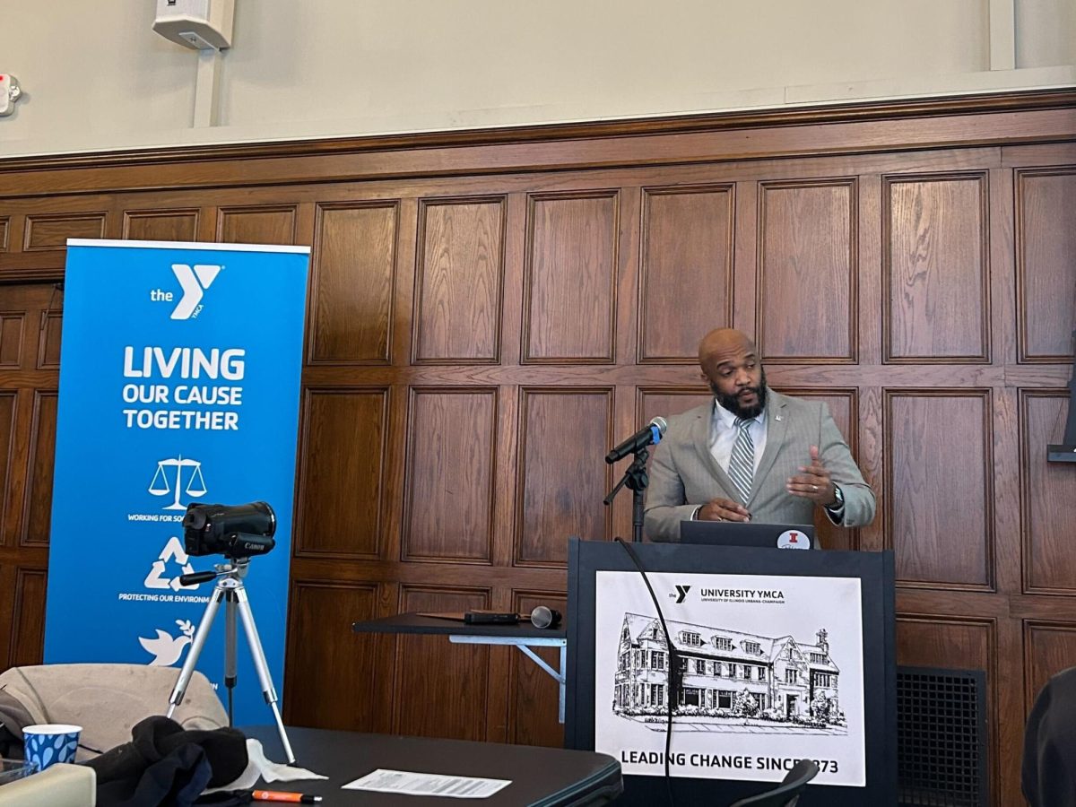Urbana Mayor DeShawn Williams stands at the University YMCA on Feb. 6. Williams spoke to the crowd about community power and Black History Month. 