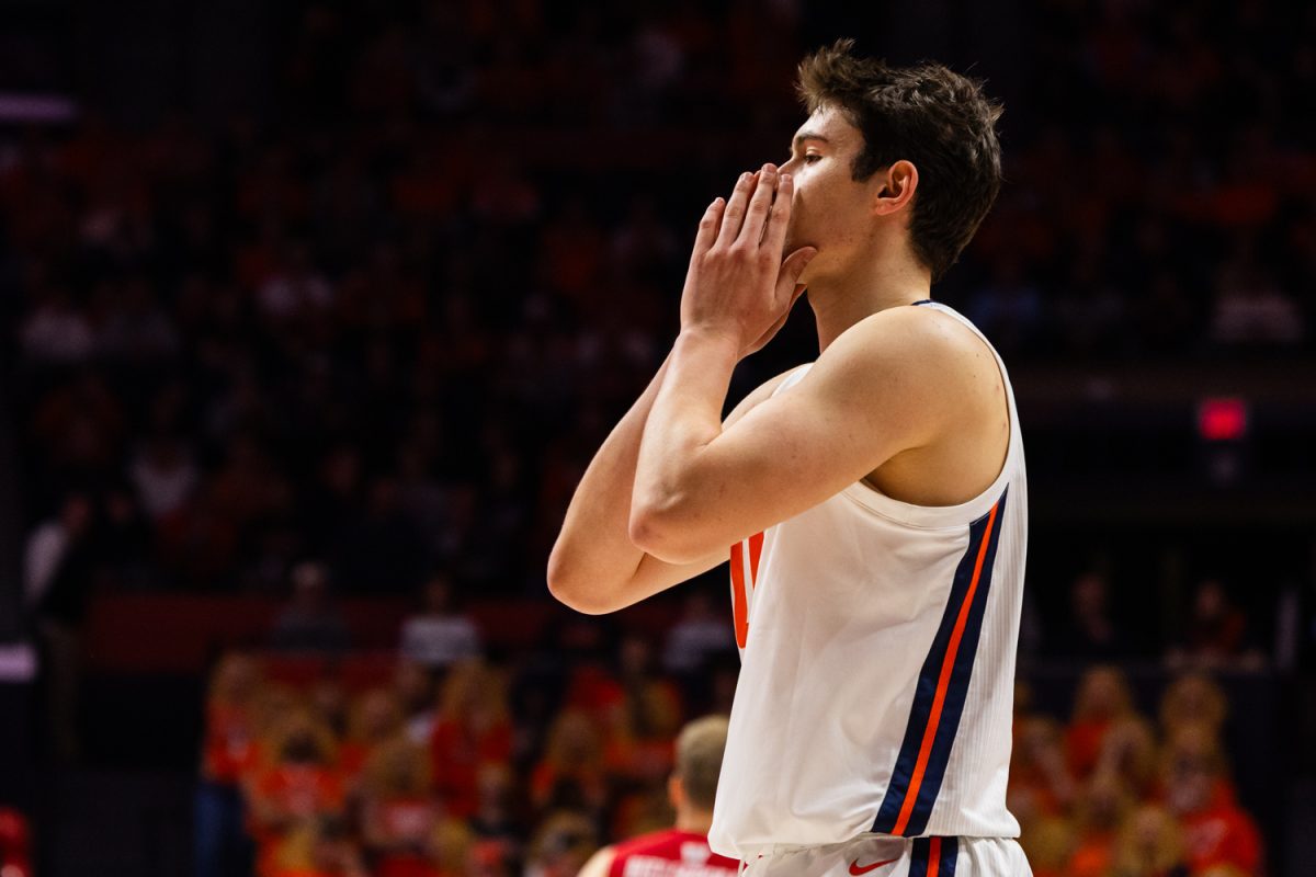 Freshman forward David Mirković reacts after a Wisconsin basket in the first half against Illinois on Feb. 10 at State Farm Center.