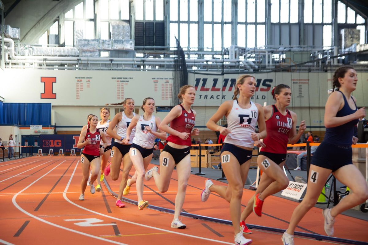 Long distance runners from several universities in Illinois race in the women’s one mile event at the Illini Last Chance indoor track and field meet held at the Armory on Feb 20.