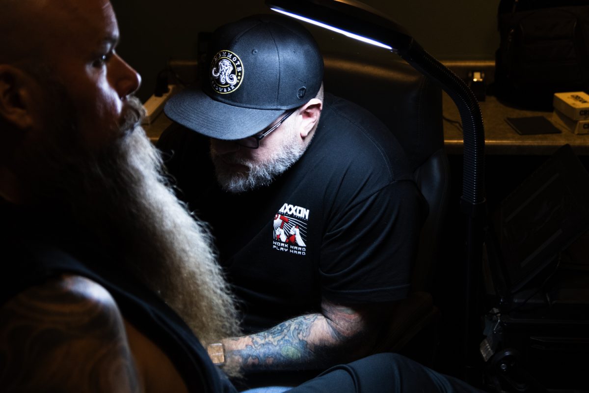 Matt Stines, owner of No Regrets Tattoos and Body Piercings, works on a client's sleeve Feb. 21, 2025. No Regrets is home to several local artists and piercers with unique styles and various levels of experience.