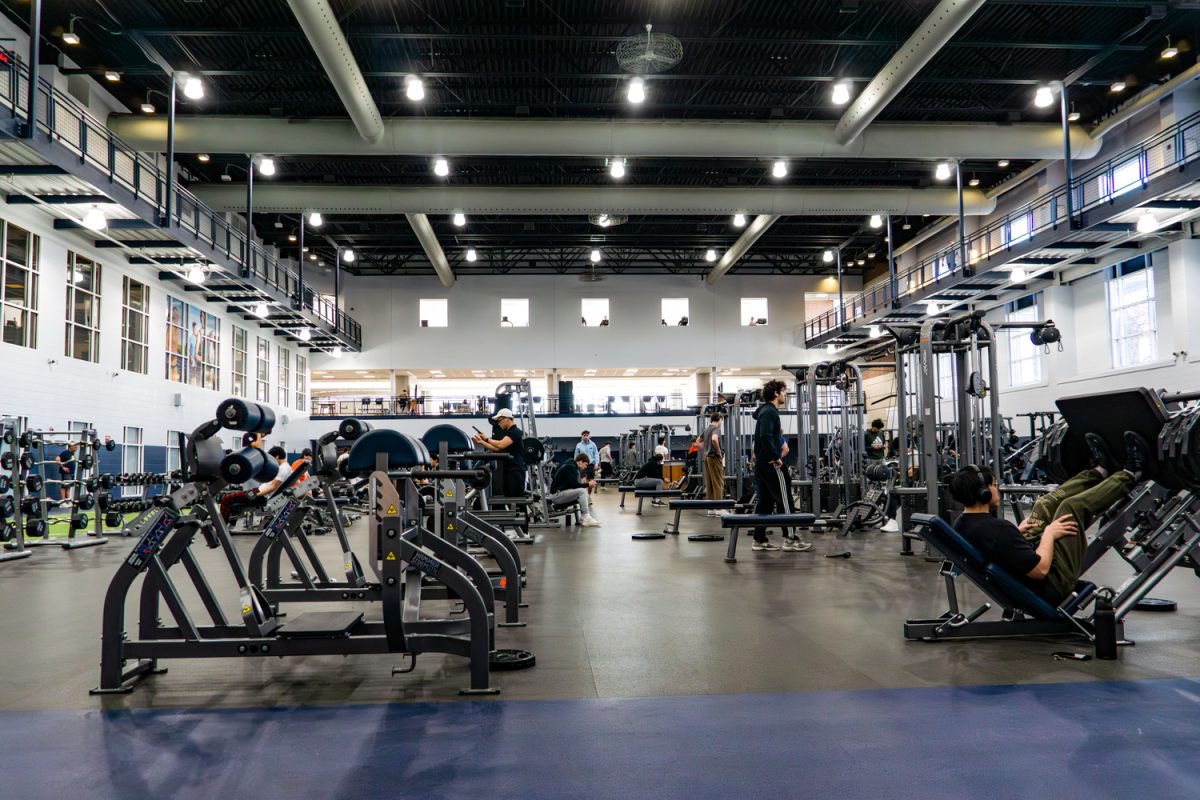Students work out in the main room of the Activities and Recreation Center on Feb. 21. The building, located near student housing, contains multiple floors of various fitness equipment.