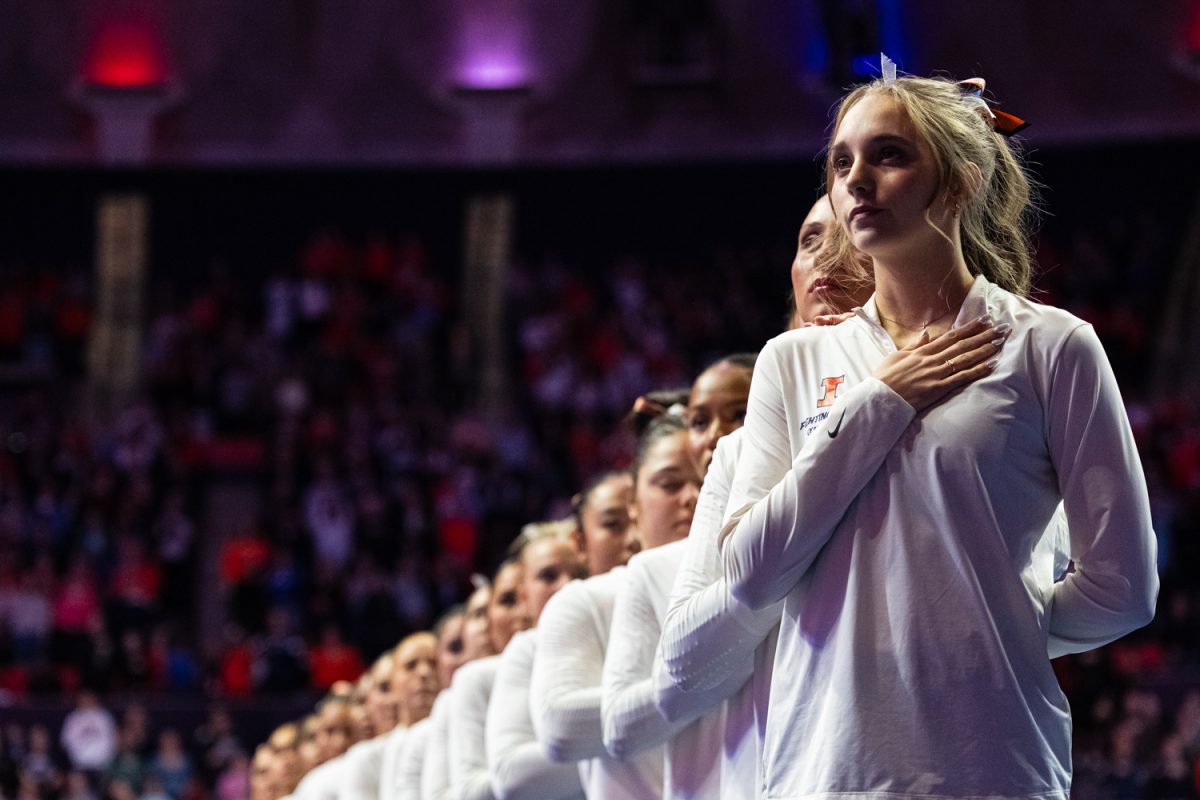 The Illinois women's gymnastics team stands during he national anthem Feb. 22 in the State Farm Center.