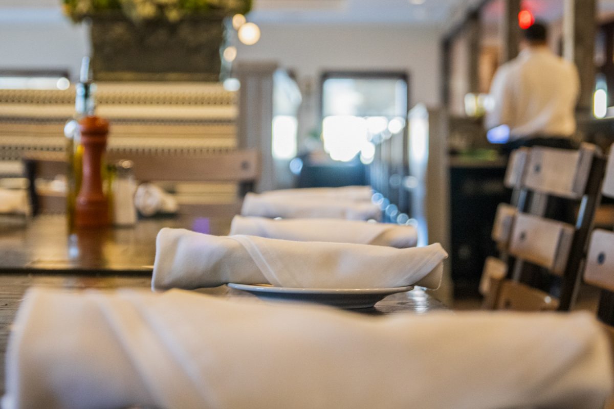 A table is set for a company dinner at Biaggi's Ristorante Italiano on March 3, 2025. Its menu features classic Italian dishes and desserts.