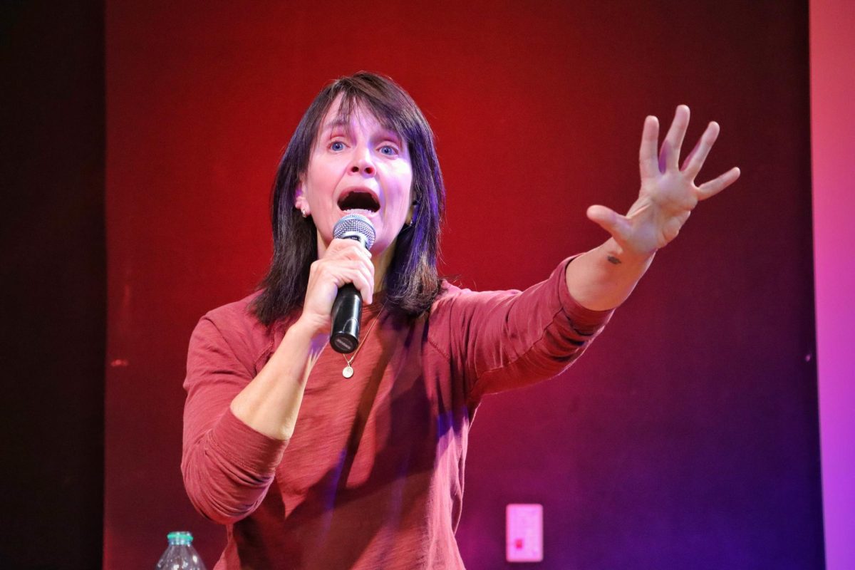 Comedian Leslie Mitchell gestures enthusiastically during a stand-up comedy routine March 27. Individuals can attend Friday Funnies for free at the Illini Union every Friday starting at 7 p.m. in the Courtyard Café.