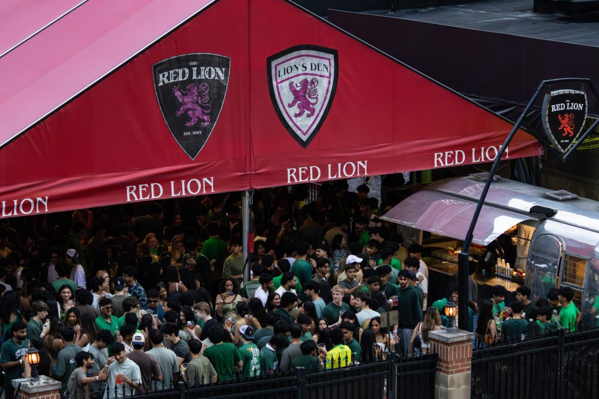 Bar patrons fill the outside area of The Red Lion on March 6 during Unofficial St. Patrick's Day. 
