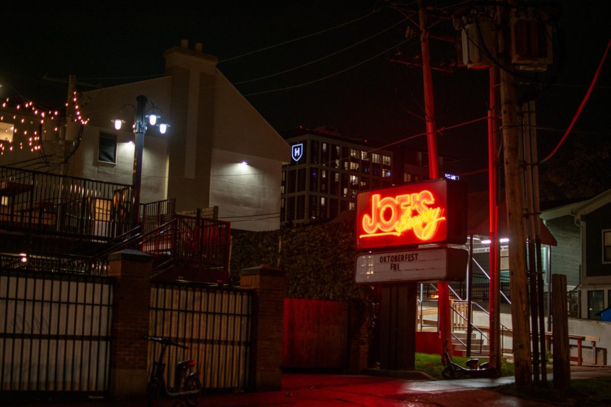 A red neon Joe's Brewery sign illuminates the establishment on Oct. 25, 2023. Joe's Brewery's liquor license was suspended by the state liquor commission.