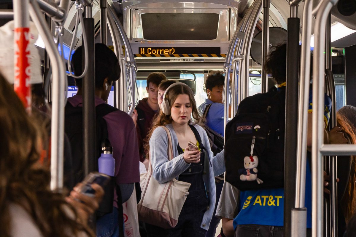 Champaign-Urbana Mass Transit District passengers take the 22 Illini bus on Feb. 18. The bus route stops at many residence halls on campus and other locations frequented by Illinois students.