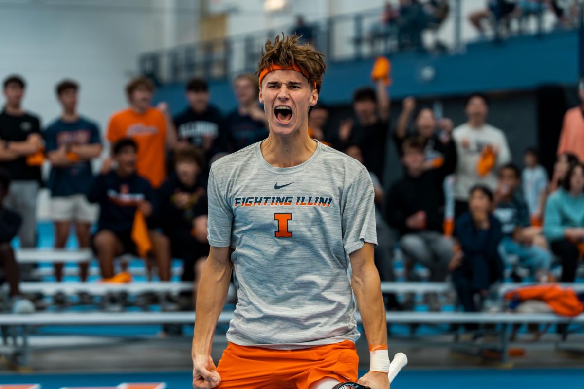 Freshman Gabriel Debru celebrates winning a massive point against Oregon at Atkins Tennis Tennis on Mar 6.