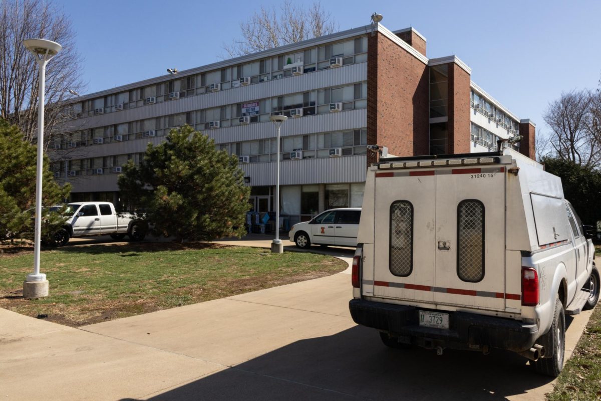 Work trucks sit outside Snyder hall on March 18, shortly after a major flood closed the residence hall for the rest of the semester.