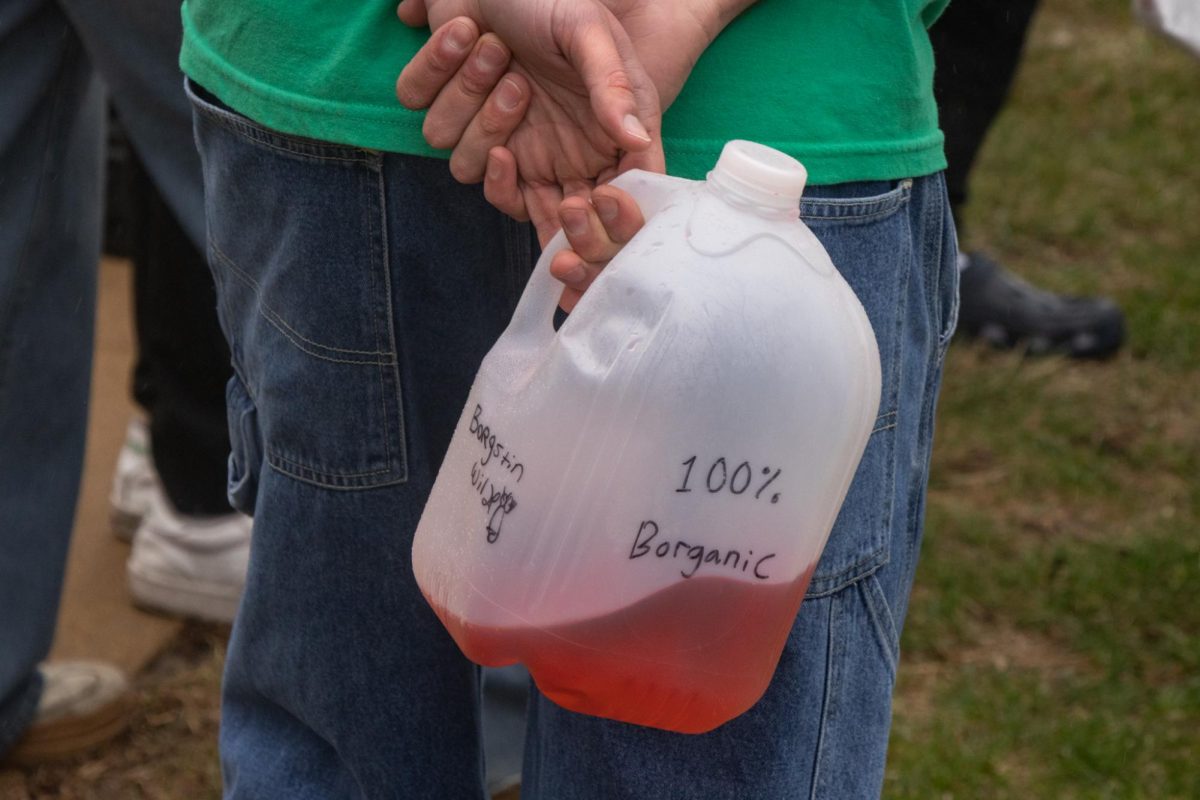 One man holds a BORG at the first annual Running of the Gingers at John and Oak streets on March 7.