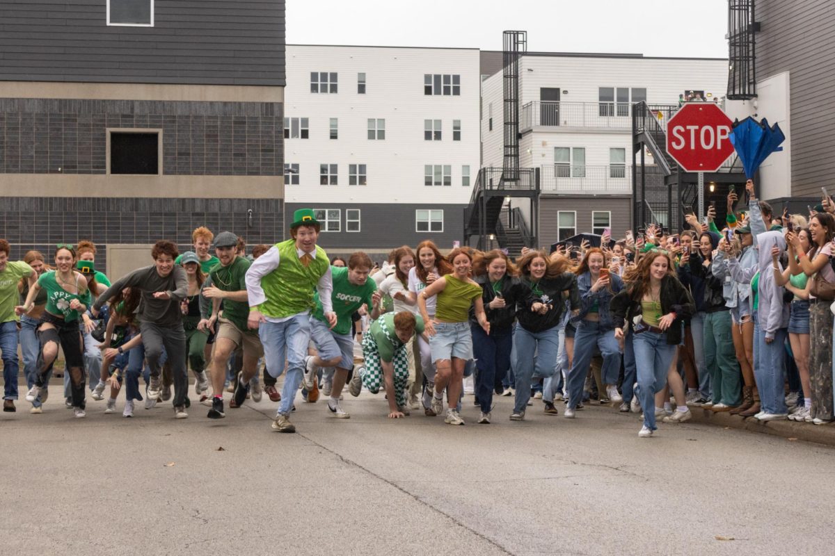 Redheaded people dash out from the starting line of the Ginger Run during Unofficial weekend on March 7. The event was organized on social media, taking inspiration from similar races on other college campuses.