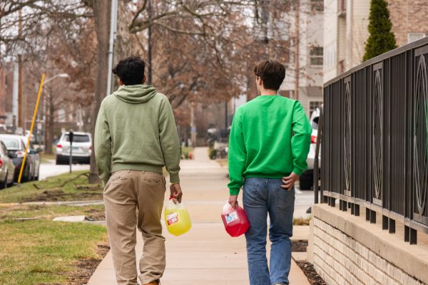 Two men walk down South Second Street carrying BORGs on Saturday afternoon. 