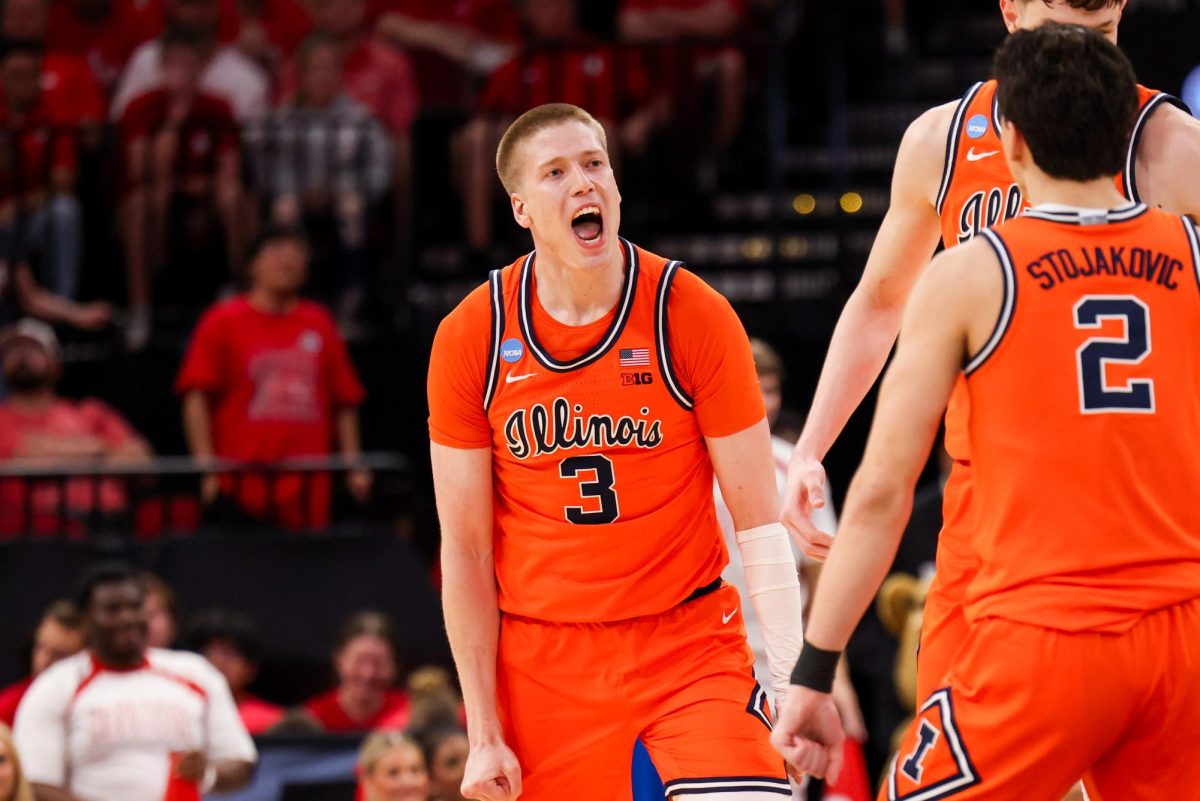 Graduate student forward Ben Humrichous screams after hitting a 3-pointer to extend Illinois’ run to 17-0 during the second half of its Sweet Sixteen win over Houston.