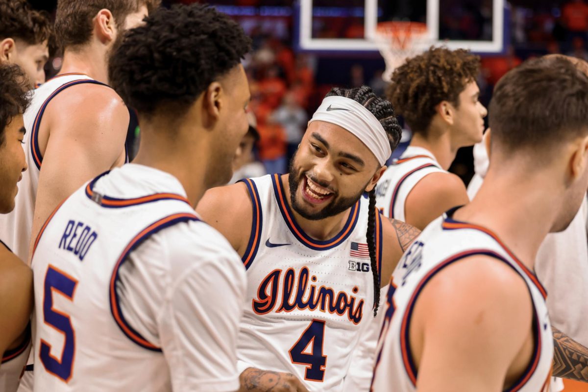 Senior guard Kylan Boswell celebrates with senior guard AJ Redd after Illinois defeated Oregon on March 3 and Redd scored the last 5 points of the game.