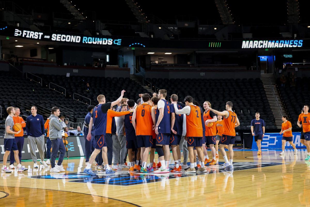 The Illlini huddle up at the conclusion of their open practice in Greenville, South Carolina, on March 18.