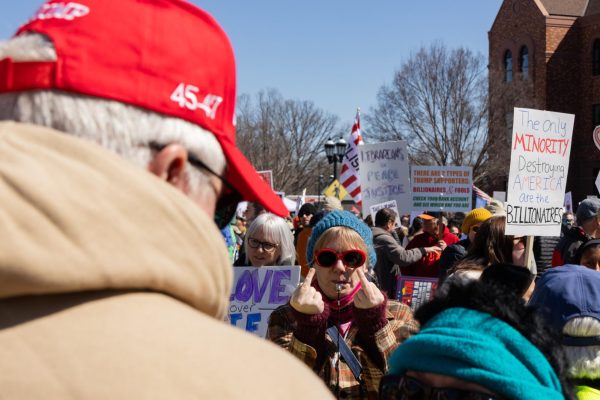 Protesters at the No Kings 3 protest argue with a counterprotester in downtown Urbana Saturday afternoon.