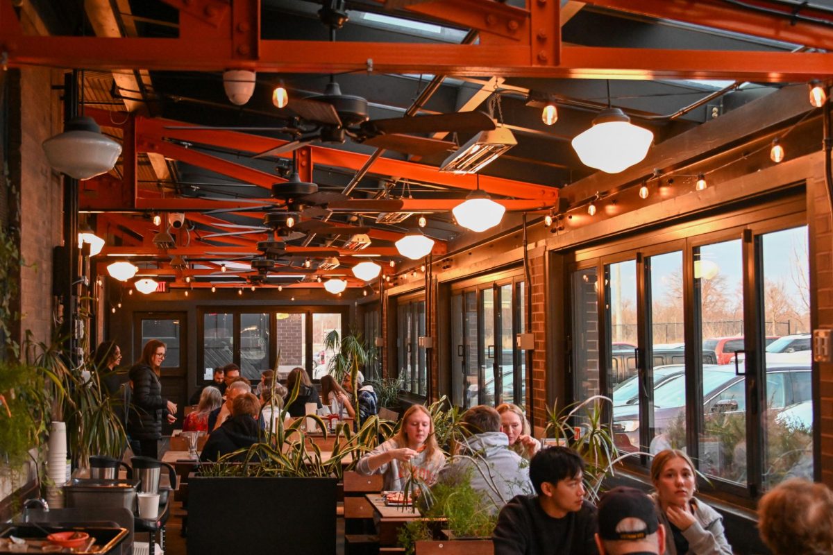 The Black Dog Smoke & Ale House bustles with patrons on Feb. 28. The restaurant is situated at 320 N Chestnut St in Champaign. 