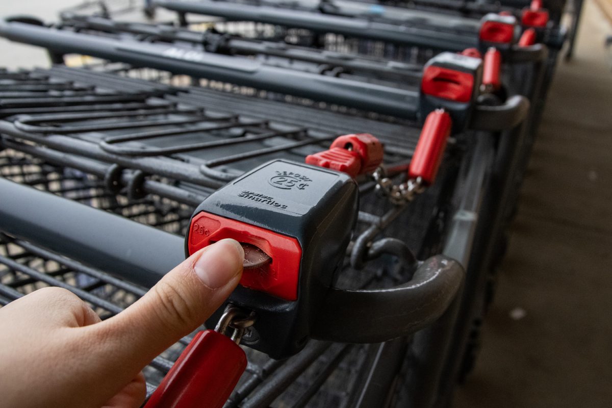 An Aldi customer inserts a quarter into a cart on March 4.