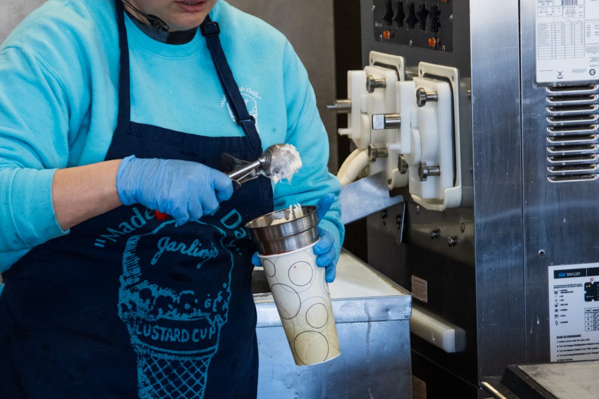 An employee scoops custard at Jarling's Custard Cup on March 2, 2025. The shop's frozen treats have been a fixture of Champaign Urbana since it was founded in 1983.