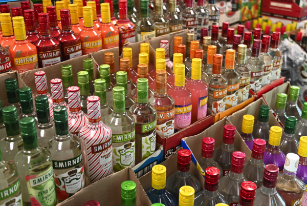 Smirnoff bottles line a shelf at Illini Pantry on Feb. 18. The City of Champaign issued an emergency order Friday halting retail liquor license holders from selling alcohol between 6 p.m. Saturday and 2:30 a.m. Sunday.