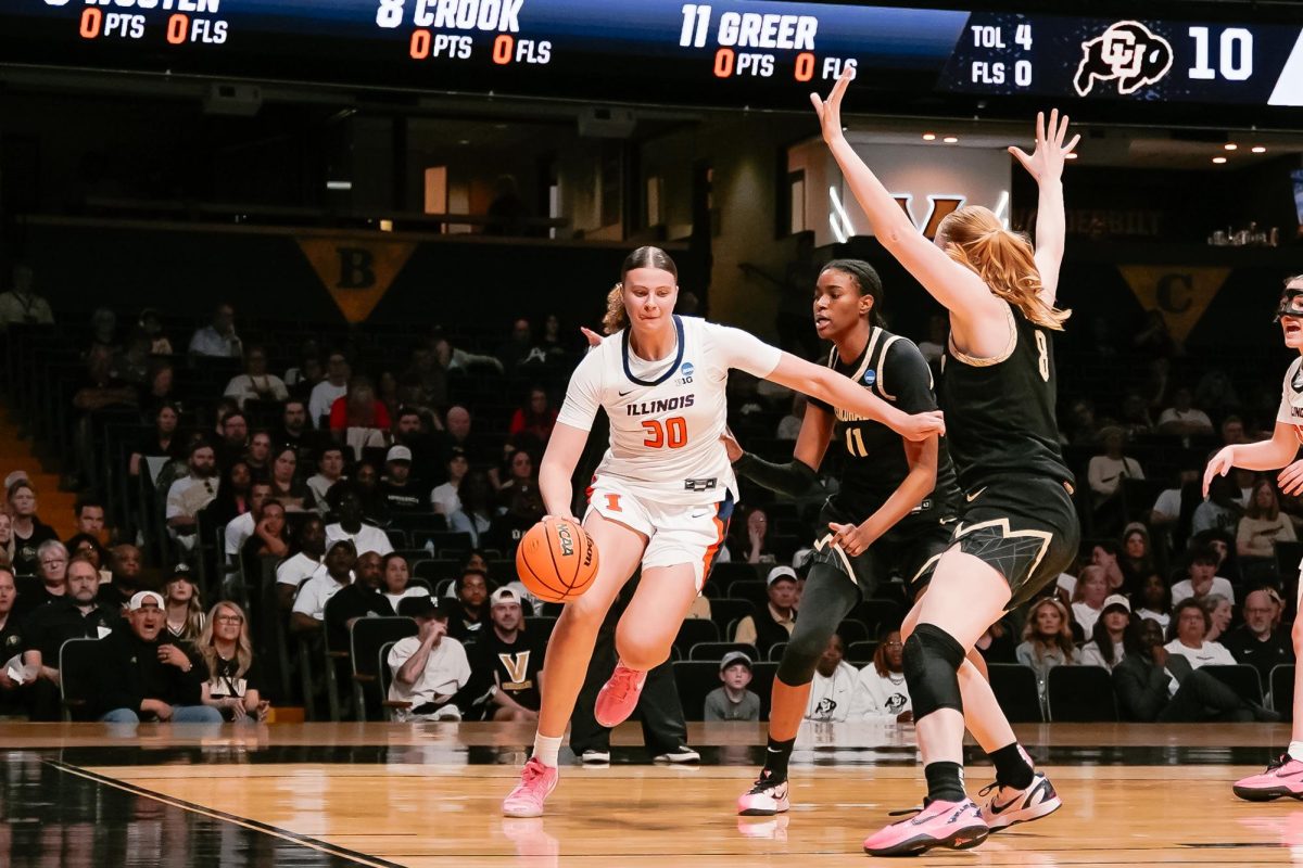 Freshman forward Cearah Parchment drives to the rim against two Colorado defenders in Illinois first round NCAA tournament win.