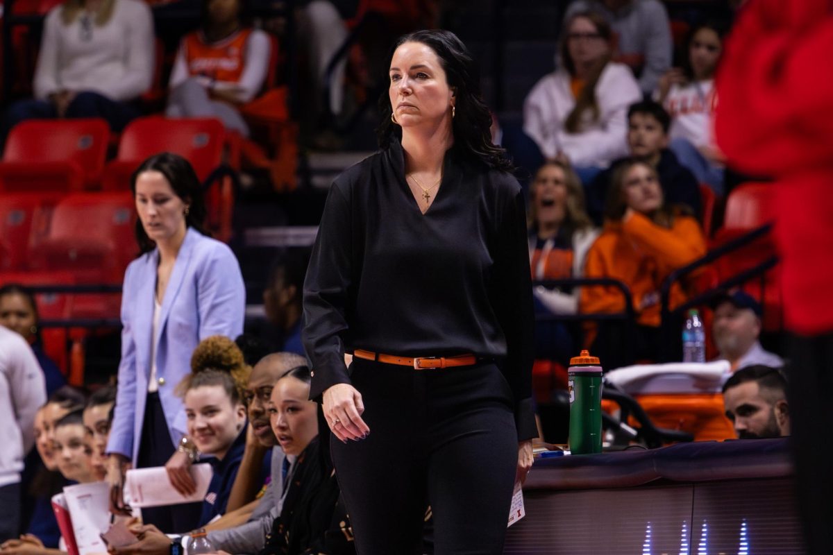 Head coach Shauna Green looks down court at the Illinois women's basketball team during their game against Rutgers on Feb. 17 at the State Farm Center. The Illini beat the Scarlett Knights 76-56.