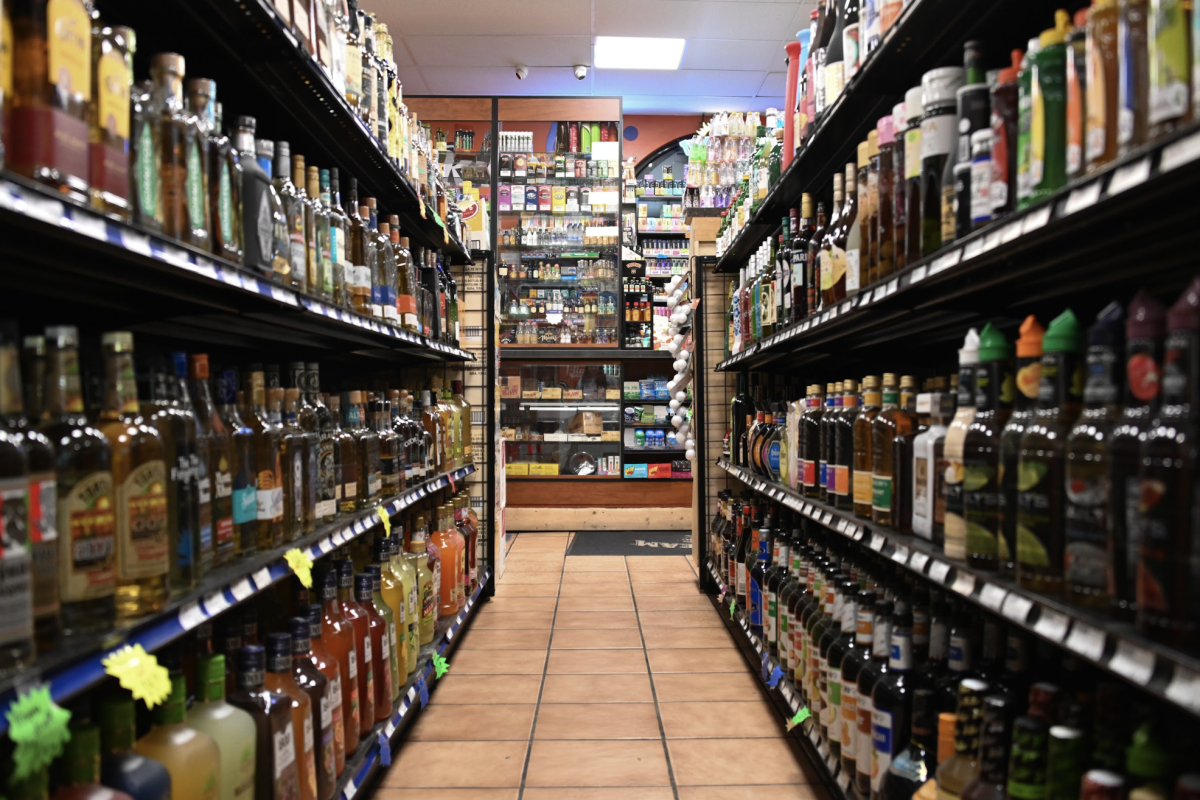 Bottles line the shelves of Illini Pantry on Feb. 18. The popular liquor store resides just off Green Street at 606 S 6th St, Champaign, IL.