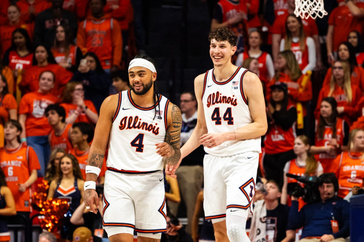 Senior guard Kylan Boswell and junior forward Zvonimir Ivisic laugh during the game versus Oregon March 3. The Illini defeated the Ducks 80-54.